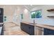 Modern kitchen featuring sleek cabinets, stainless steel appliances, and butcher block countertops at 3975 Yates St, Denver, CO 80212