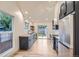 Modern kitchen with stainless steel appliances, sleek cabinets, and an open-concept design at 3975 Yates St, Denver, CO 80212