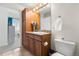 Bathroom boasting a vanity with a granite countertop and ample cabinet space at 1950 N Logan St # 905, Denver, CO 80203