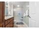 Bathroom has a vanity with granite countertop, and an enclosed glass shower at 1950 N Logan St # 905, Denver, CO 80203