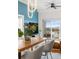 Bright dining room with modern lighting, balcony access, and stylish decor for comfortable living at 1950 N Logan St # 905, Denver, CO 80203