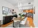 Dining room and kitchen area featuring an open plan and modern decor at 1950 N Logan St # 905, Denver, CO 80203