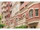 Stately exterior of a modern apartment building with brick facade and multiple balconies at 1950 N Logan St # 905, Denver, CO 80203