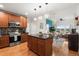Well-lit kitchen flowing into the living and dining areas, with stainless appliances at 1950 N Logan St # 905, Denver, CO 80203