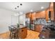 A modern kitchen equipped with stainless steel appliances and a center island at 1950 N Logan St # 905, Denver, CO 80203
