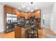 Kitchen with stainless steel appliances, center island, and hardwood flooring at 1950 N Logan St # 905, Denver, CO 80203