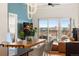 Cozy living space featuring modern decor, a balcony with city views, and an open layout at 1950 N Logan St # 905, Denver, CO 80203