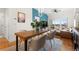 Open-concept living and dining area with modern decor, balcony, and city views at 1950 N Logan St # 905, Denver, CO 80203