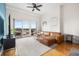 Bright living room with a comfortable sofa, modern decor, and a balcony overlooking the city at 1950 N Logan St # 905, Denver, CO 80203