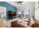 Inviting living room with contemporary decor, a comfortable sofa, and scenic balcony views at 1950 N Logan St # 905, Denver, CO 80203