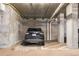 Secured indoor parking spot with painted lines and concrete walls, housing an SUV at 1950 N Logan St # 905, Denver, CO 80203