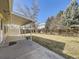 Spacious backyard featuring a covered patio and plenty of room for outdoor activities at 13853 W 66Th Pl, Arvada, CO 80004