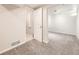 Spacious basement featuring neutral paint colors and cozy carpeting at 13853 W 66Th Pl, Arvada, CO 80004