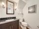 Charming half-bath with modern fixtures, granite vanity, and stylish decor provides comfort and elegance at 13853 W 66Th Pl, Arvada, CO 80004