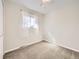 Bright bedroom with plush carpeting, natural light, and neutral walls provides a serene and comfortable space at 13853 W 66Th Pl, Arvada, CO 80004