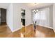 Dining room with hardwood floors, a chandelier, and view into kitchen with stainless appliances at 13853 W 66Th Pl, Arvada, CO 80004