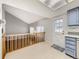 Eat-in kitchen with stainless appliances, shaker cabinets, and access to backyard at 13853 W 66Th Pl, Arvada, CO 80004