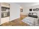 Open floor plan living room featuring wood floors, an accent rug, and grey sofa set at 13853 W 66Th Pl, Arvada, CO 80004