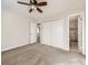 Spacious bedroom with carpet, ceiling fan, and en-suite bath provides a relaxing retreat at 13853 W 66Th Pl, Arvada, CO 80004