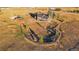 Aerial view of home on sprawling acreage features fenced yard, mature trees and outbuildings at 2312 Arabian Trl, Elizabeth, CO 80107