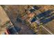 Bird's eye view of modern home shows spacious fenced lot, outbuildings, and circular drive at 2312 Arabian Trl, Elizabeth, CO 80107