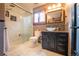 Bathroom featuring a modern glass enclosed walk-in shower and vanity with vessel sink at 2312 Arabian Trl, Elizabeth, CO 80107