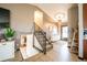 A welcoming entryway features hardwood floors, stylish lighting, and modern decor at 2312 Arabian Trl, Elizabeth, CO 80107
