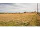 View of home on large lot shows open field, outbuildings and fencing at 2312 Arabian Trl, Elizabeth, CO 80107