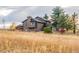 Charming two-story home surrounded by mature trees and a well-maintained yard at 2312 Arabian Trl, Elizabeth, CO 80107