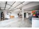 Spacious garage featuring a high ceiling and ample storage space for tools and other equipment at 2312 Arabian Trl, Elizabeth, CO 80107