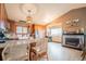 Bright kitchen featuring stainless steel appliances, hardwood floors, granite countertops and a fireplace at 2312 Arabian Trl, Elizabeth, CO 80107