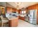 Modern kitchen featuring stainless steel appliances, granite countertops, hardwood floors and central island at 2312 Arabian Trl, Elizabeth, CO 80107