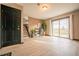 Open-concept living area with lots of light from the sliding glass doors at 2312 Arabian Trl, Elizabeth, CO 80107