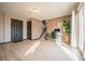 Open-concept living area featuring sleek floors, a home office area, and modern decor at 2312 Arabian Trl, Elizabeth, CO 80107