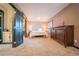 Inviting main bedroom featuring carpet floors, a closet, an ensuite bathroom and natural light at 2312 Arabian Trl, Elizabeth, CO 80107