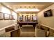 Community game room features billiard table, comfortable seating areas, and contemporary lighting at 4625 W 50Th Ave # 203, Denver, CO 80212