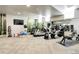 Modern community gym features treadmills, weights and scenic forest backdrop at 4625 W 50Th Ave # 203, Denver, CO 80212