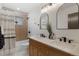Elegant bathroom features a double vanity, modern fixtures, and a shower-tub combination with stylish tile at 2810 N Harrison St, Denver, CO 80205