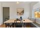 Cozy dining area with a built-in bench, stylish table setting, and natural light from a nearby window at 2810 N Harrison St, Denver, CO 80205