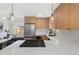 Contemporary kitchen features stainless steel appliances, a gas cooktop, and ample counter space at 2810 N Harrison St, Denver, CO 80205