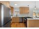 Well-appointed kitchen boasts modern cabinets, stainless steel appliances, and a functional layout for cooking and entertaining at 2810 N Harrison St, Denver, CO 80205