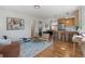 Open-concept living space boasts hardwood floors, modern furnishings, and a seamless flow to the kitchen at 2810 N Harrison St, Denver, CO 80205