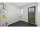 Well-lit utility room featuring clean finishes, tile floors and modern design at 2810 N Harrison St, Denver, CO 80205