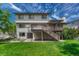 Spacious backyard featuring a wooden deck and lush green lawn, perfect for outdoor entertaining and relaxation at 302 Northridge Rd, Highlands Ranch, CO 80126