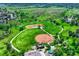 Aerial view of community baseball fields nestled in green space and lush landscaping at 302 Northridge Rd, Highlands Ranch, CO 80126