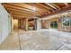 Unfinished basement with exposed rafters and beams shows great potential at 302 Northridge Rd, Highlands Ranch, CO 80126