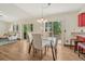 Bright dining area with hardwood floors and sliding door access to the deck at 302 Northridge Rd, Highlands Ranch, CO 80126