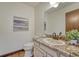 Neutral half bathroom with granite countertop and white vanity at 302 Northridge Rd, Highlands Ranch, CO 80126