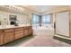 Bathroom boasting double sink vanity, soaking tub, walk-in shower with gold trim and ample lighting at 9001 W Chatfield Dr, Littleton, CO 80128