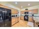 Well-maintained kitchen with ample cabinetry, granite countertops, and stainless steel appliances for modern convenience at 9001 W Chatfield Dr, Littleton, CO 80128
